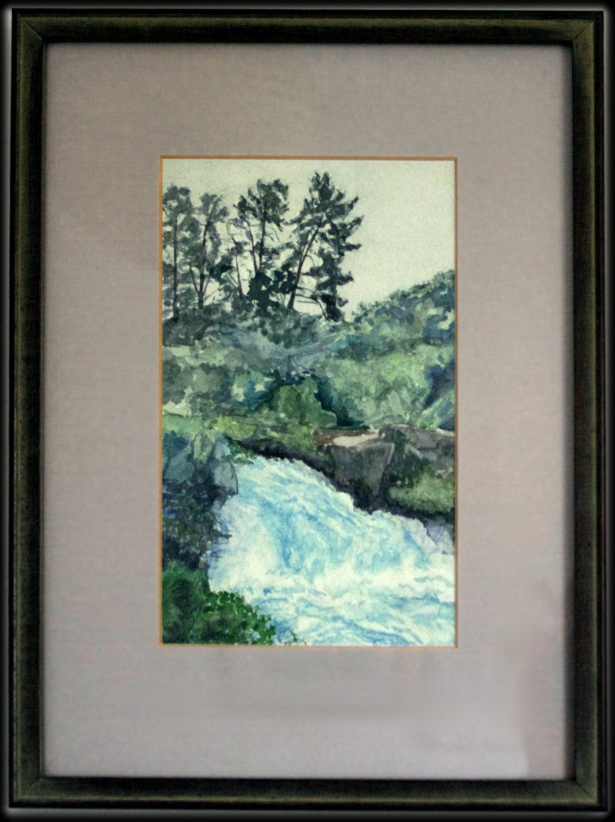 A framed watercolour of a waterfall.